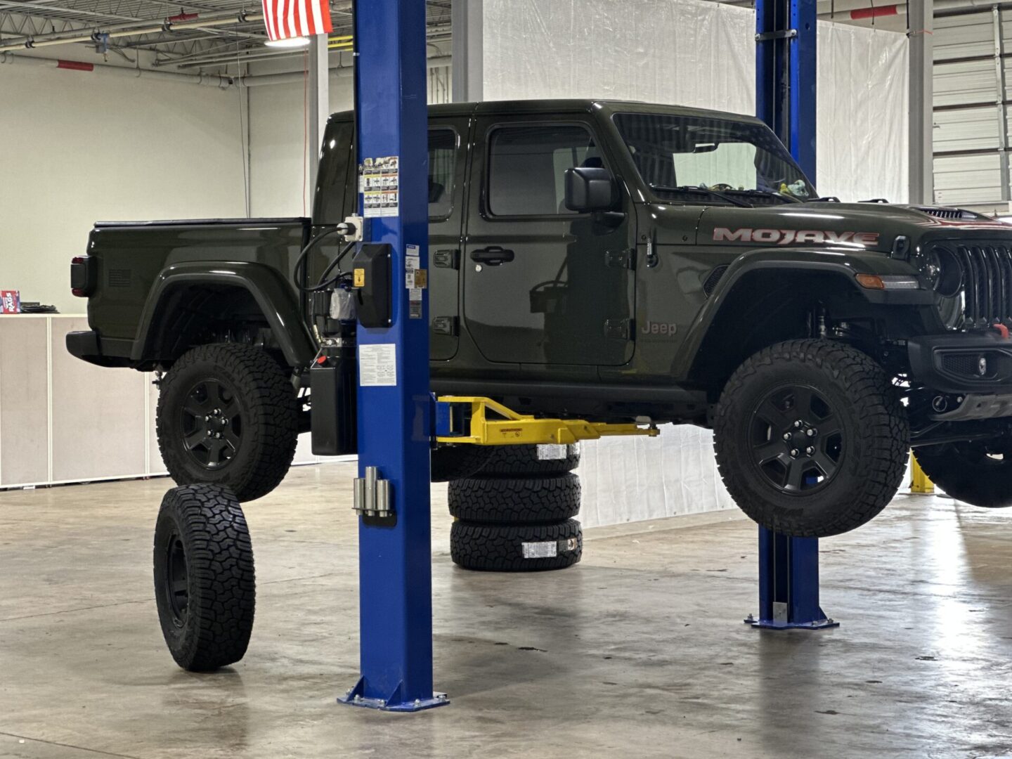 A black truck is parked in the garage